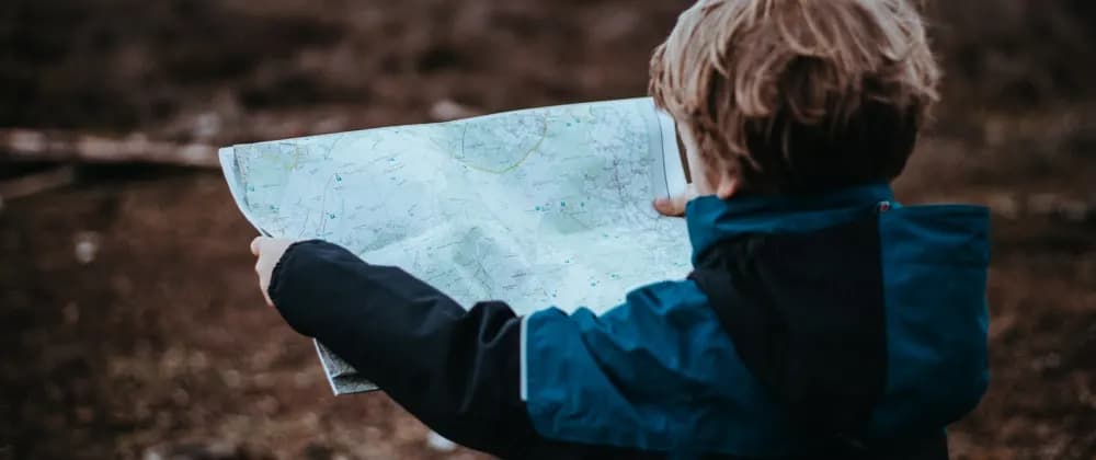 Child holding a map.